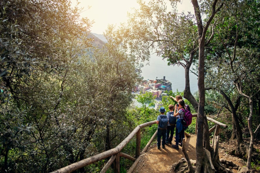 A family at an overlook, with Vernazza in the background.