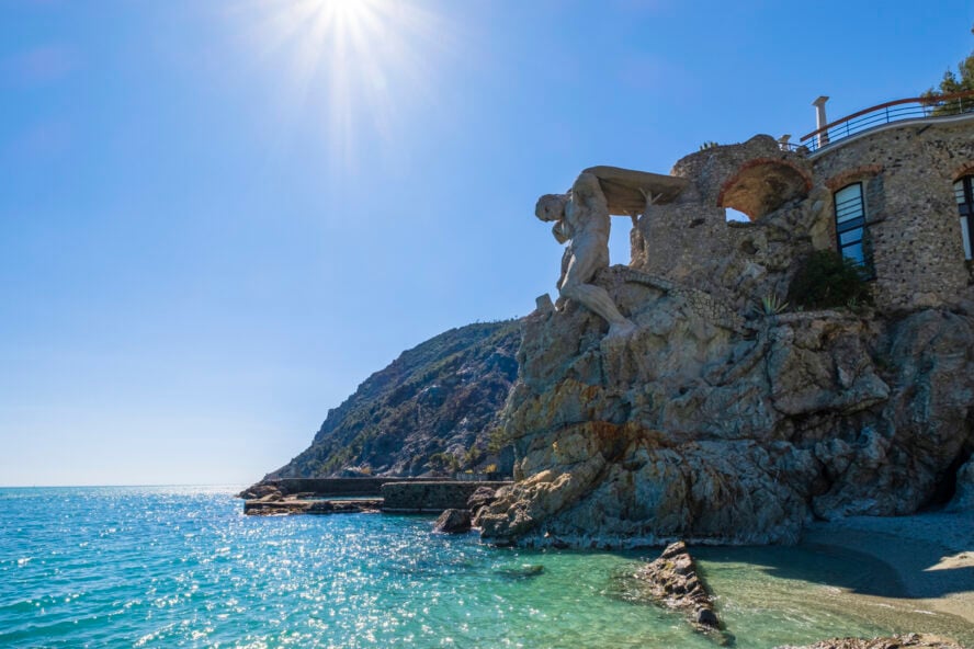 The hunched statue of Neptune looks directly onto the sea in Monterosso