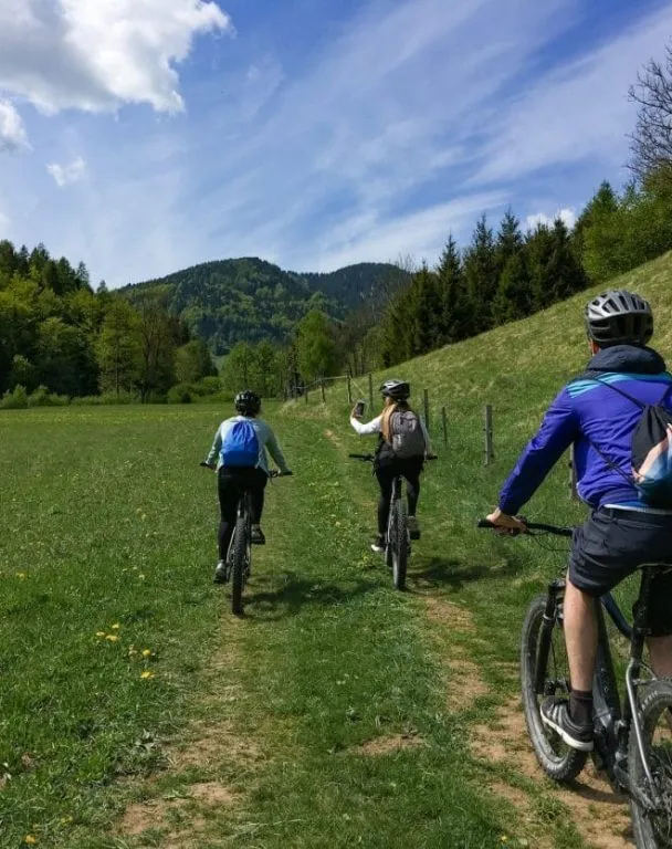 Riders admiring the Julian Alps near Kranjska Gora, Slovenia.