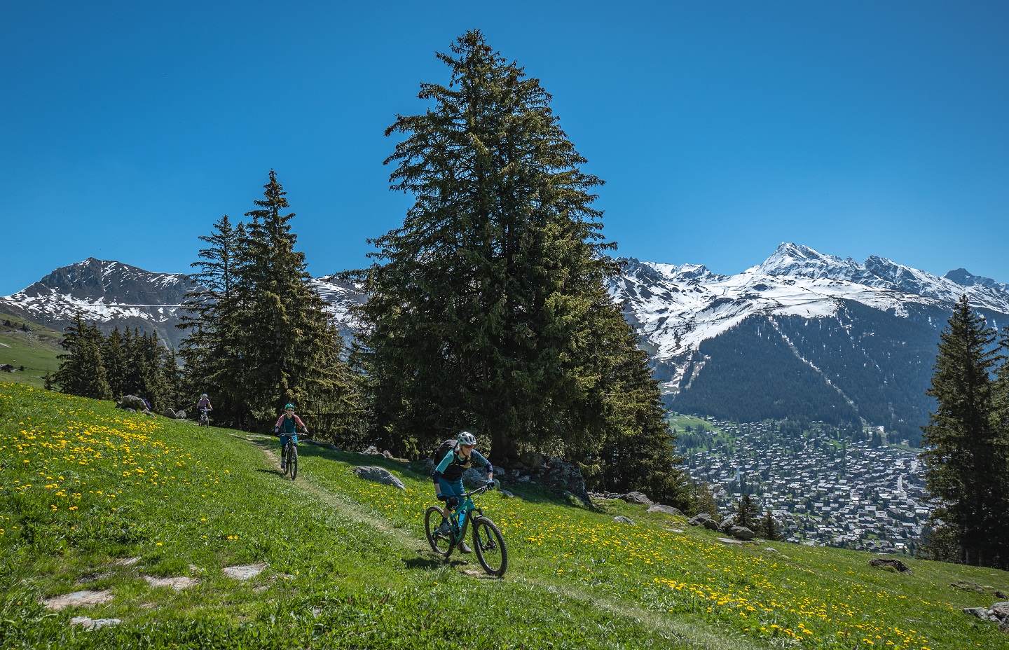 Women MTB riders enjoying the mountain trails near Verbier in the Swiss Alps.