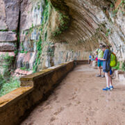 Hikers standing under Weeping Rock in Zion National Park