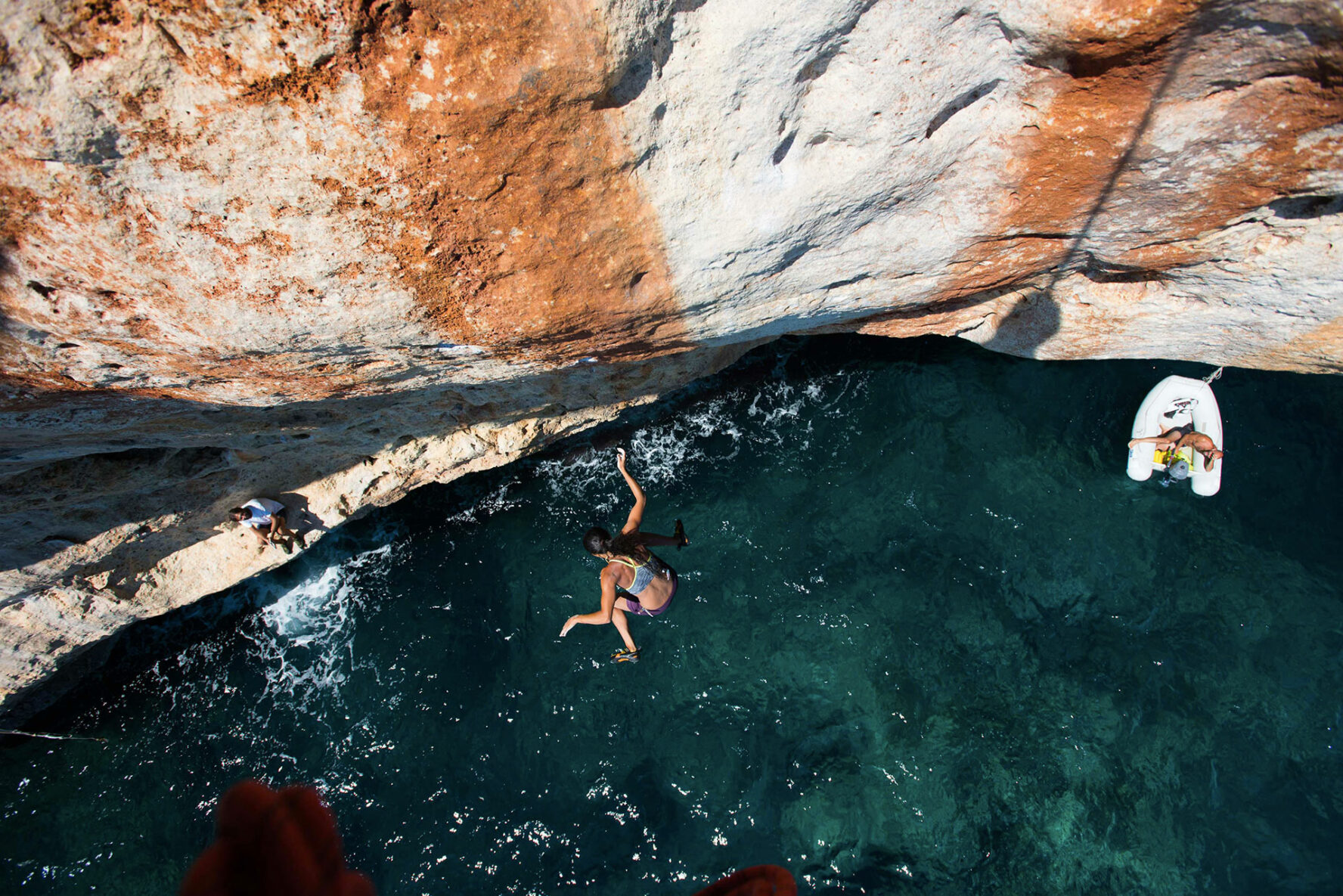 Rock climber falling down into the sea