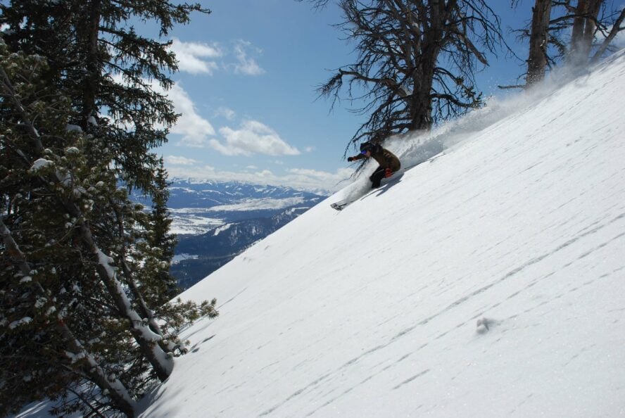 Skier flying downhill in the Teton backcountry.