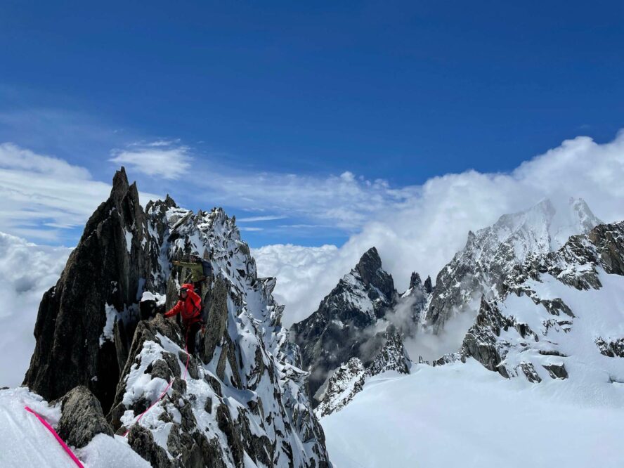 Climbers on a snowy peak in Italy.