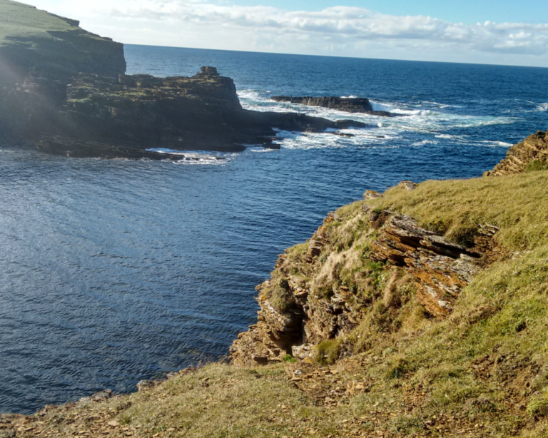 Cliffs along the sea in the Orkney Islands, United Kingdom.
