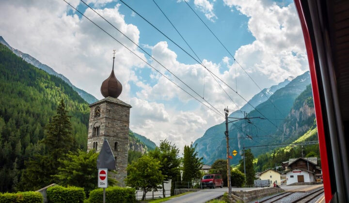 Scenicly located Swiss Alpine town of St Niklaus with a church bell.