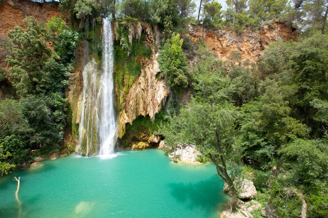 Waterfall and a turquoise pool in the Verdon Gorge.