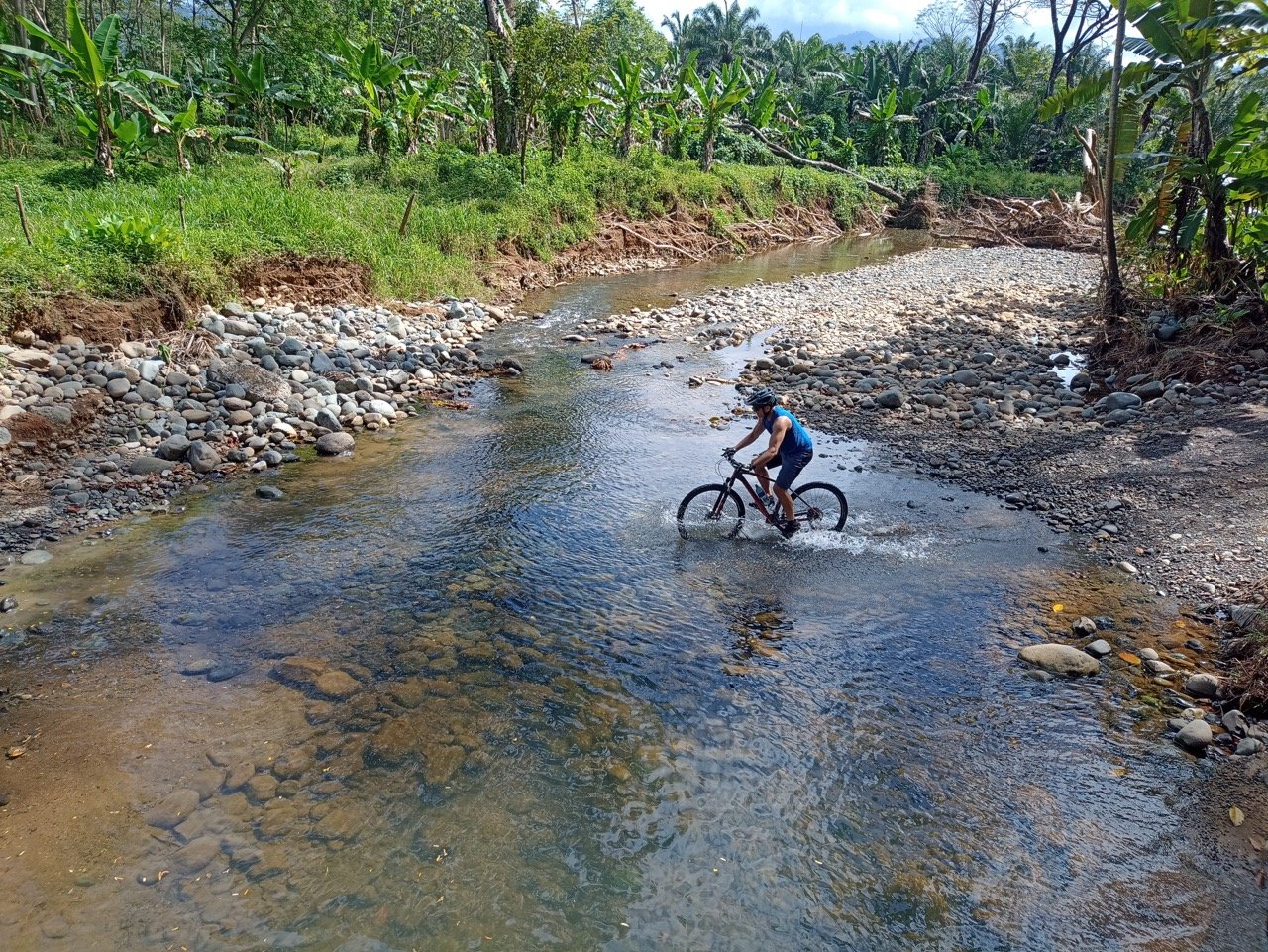 Cyclist on a river in Costa Rica
