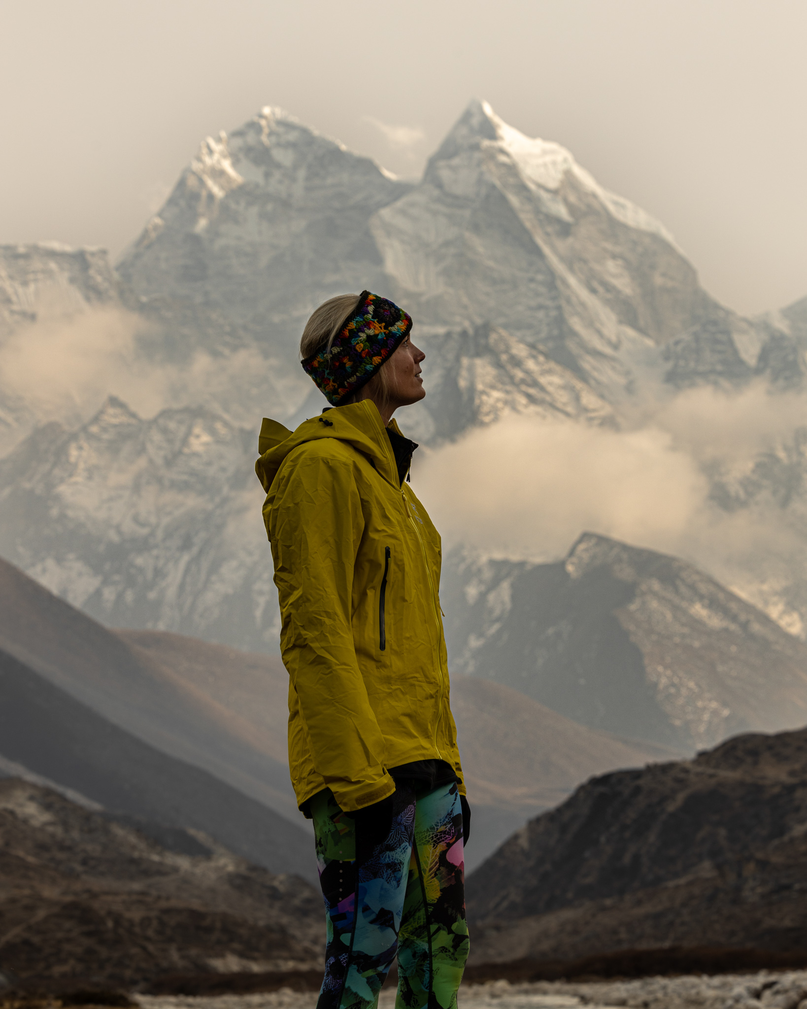 Hiker standing with mountains in the background