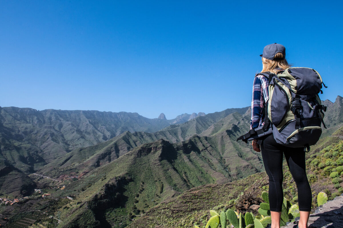 A hiker overlooking the mountainous landscapes on the island of Gomera.