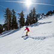 Backcountry skier ripping a turn above Lake Tahoe