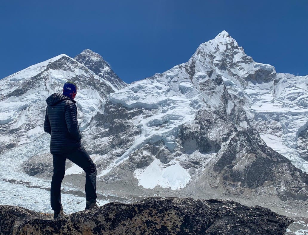 Trekker admiring the view in the Himalayas