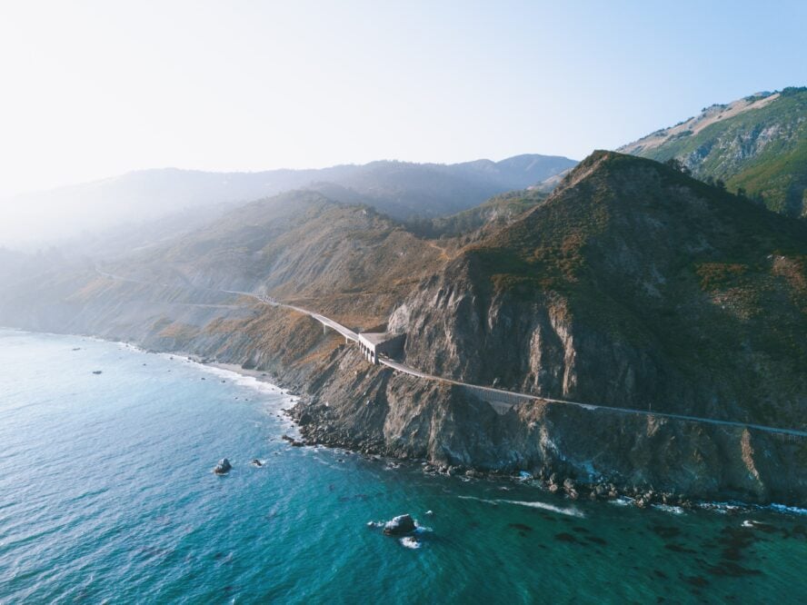 An aerial view of Highway 1, right along the coast. Many of the best hikes in Big Sur overlook the water.