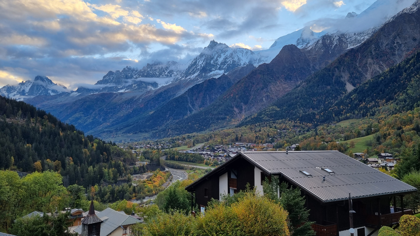 Chamonix Valley with typical villages and woods surrounded by glaciated peaks. 