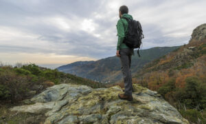 Man hiking on the Corsica Island in France in the fall