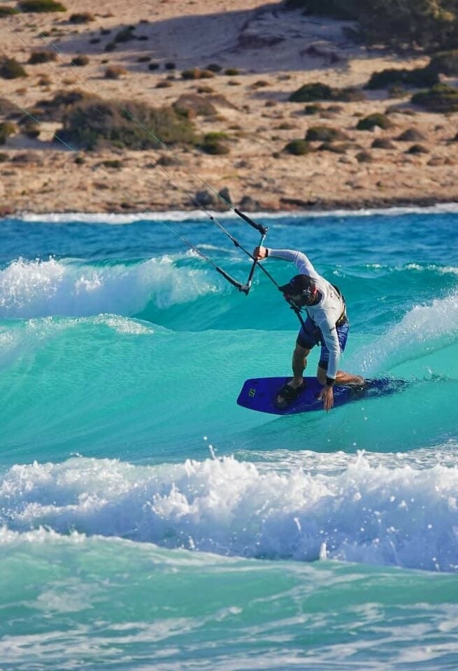 Kitesrufer in Cyclades, Greece, performing a trick