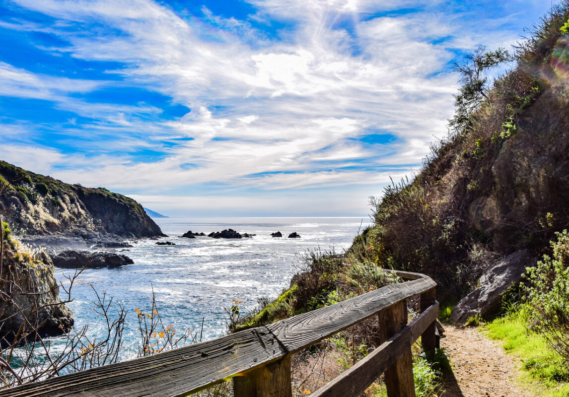 A fenced-off walkway leading to Partington Cove.
