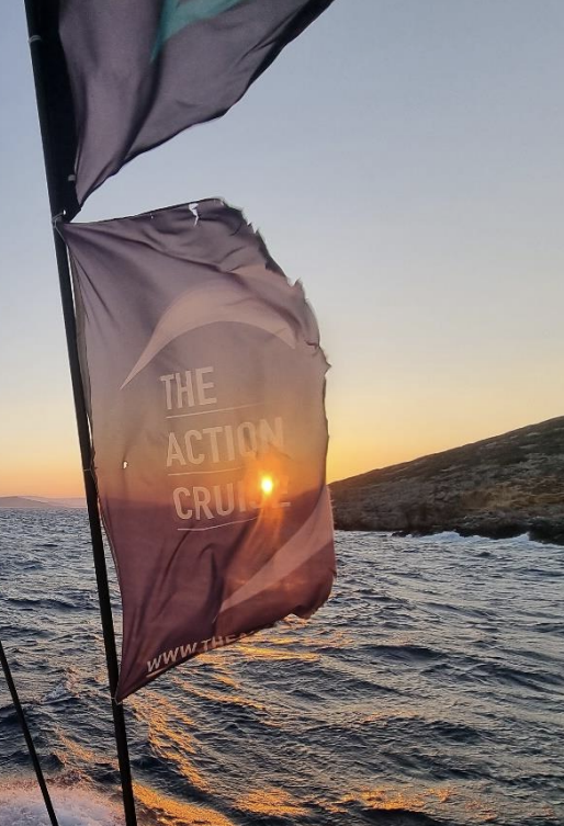 Action Cruise banner flying on a sailboat in the Mediterranean