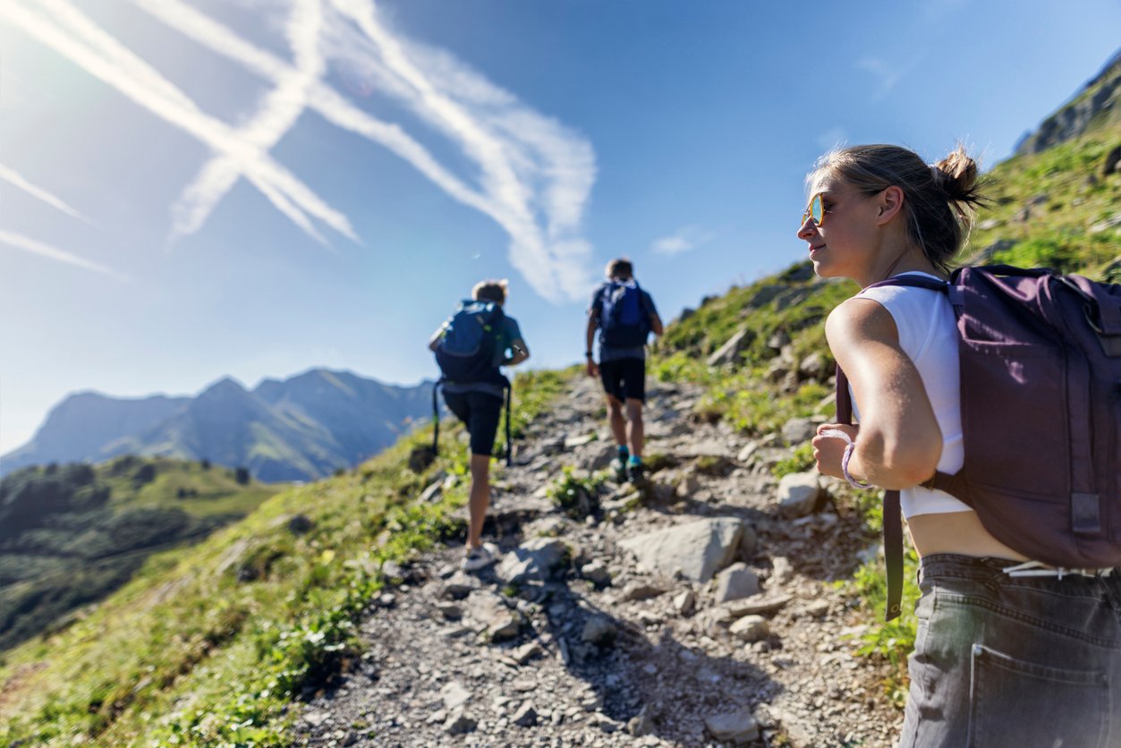 Three hikers in the Alps