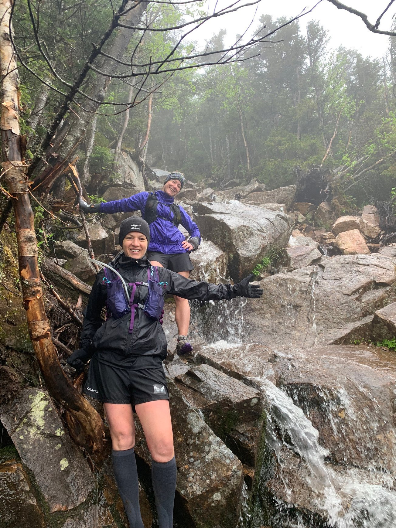 Two hikers and a waterfall