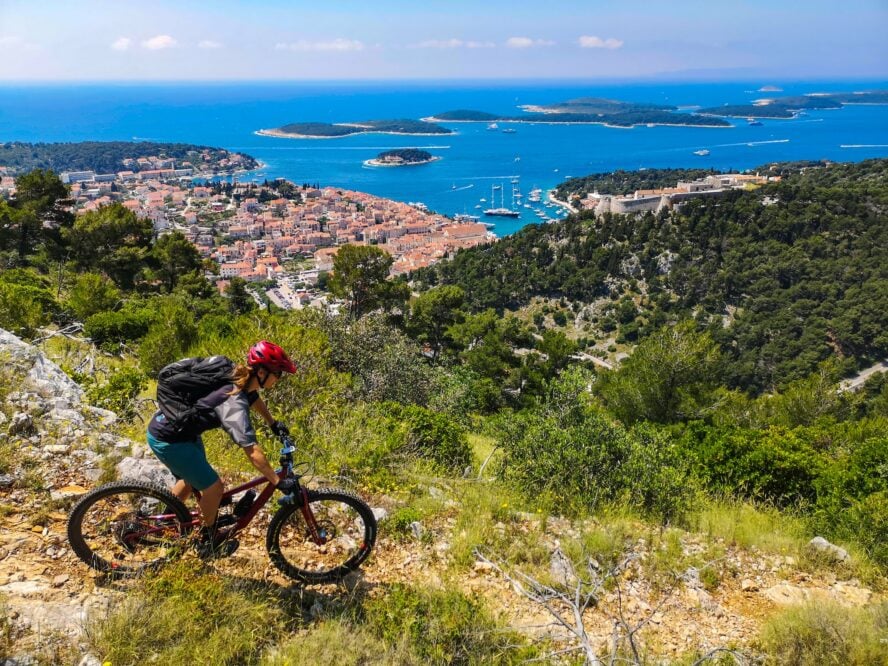 Two bikers ride along the coast of Dalmatia, Croatia