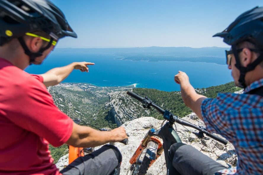 Riders point out geographical landscapes from the top of the island of Brač. 