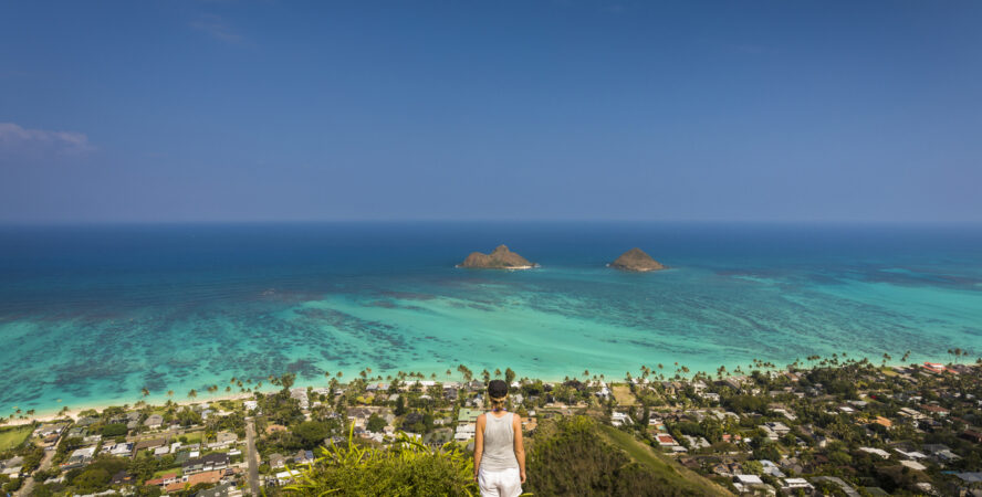 Female hiker standing on a Lanikai pillbox on Oahu