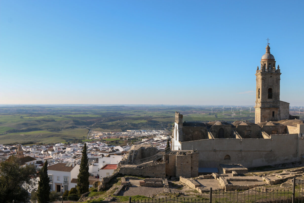 The town of Medina Sidonia in Andalucia, with a baroque church and typical whitewash houses.