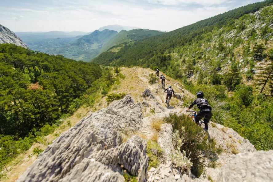 Riders in a line on a downhill trail on Imber, Omiš.