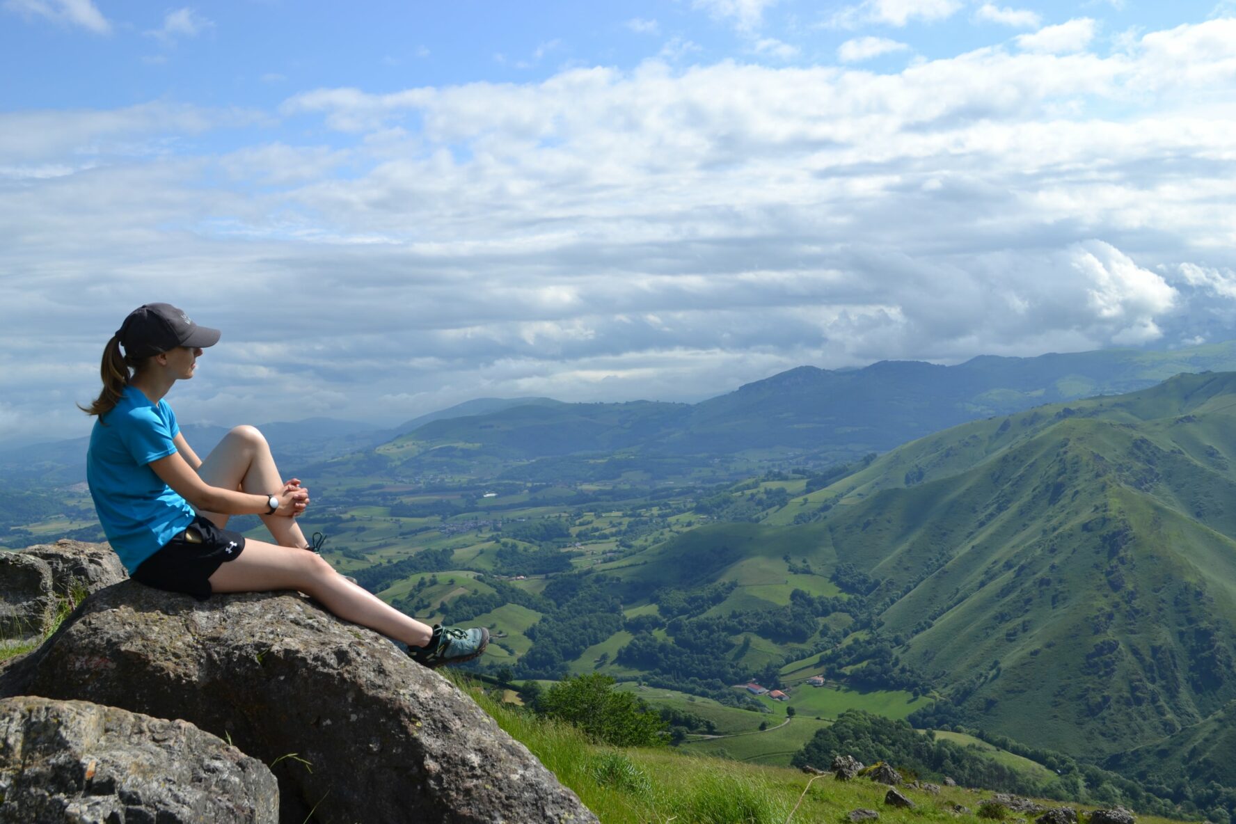 Roncesvalles hiker on a rock