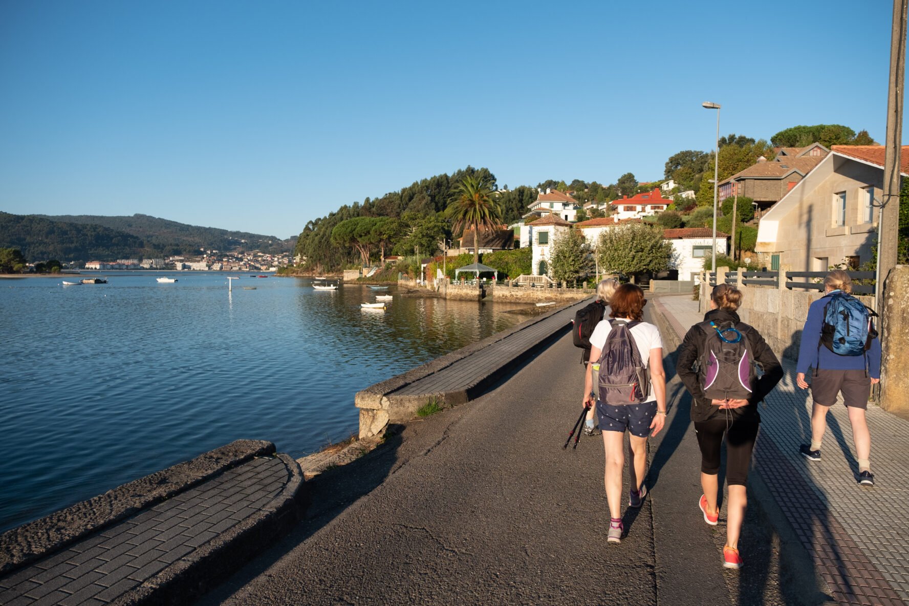 Three hikers on the seaside