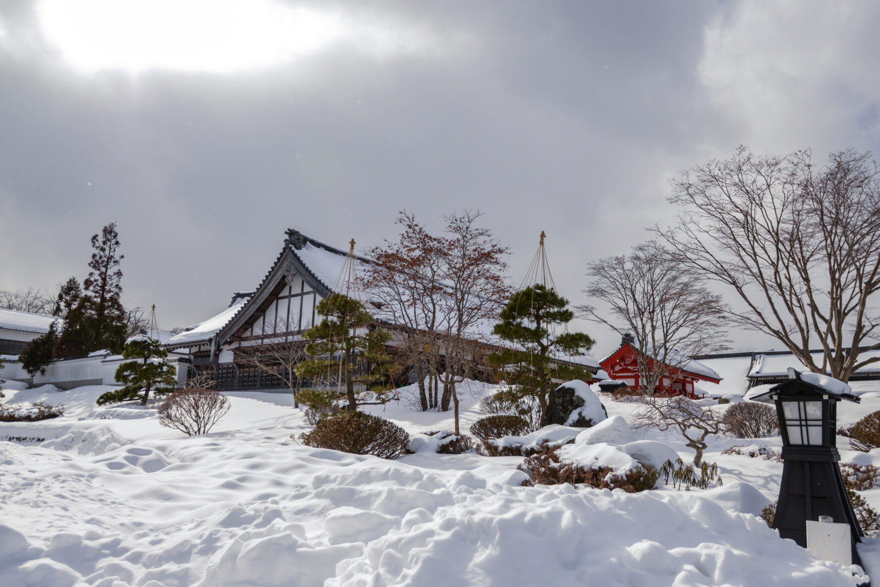 A traditional ryokan covered in snow.