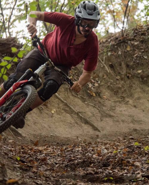 A mountain biker shredding a loamy trail in Japan.