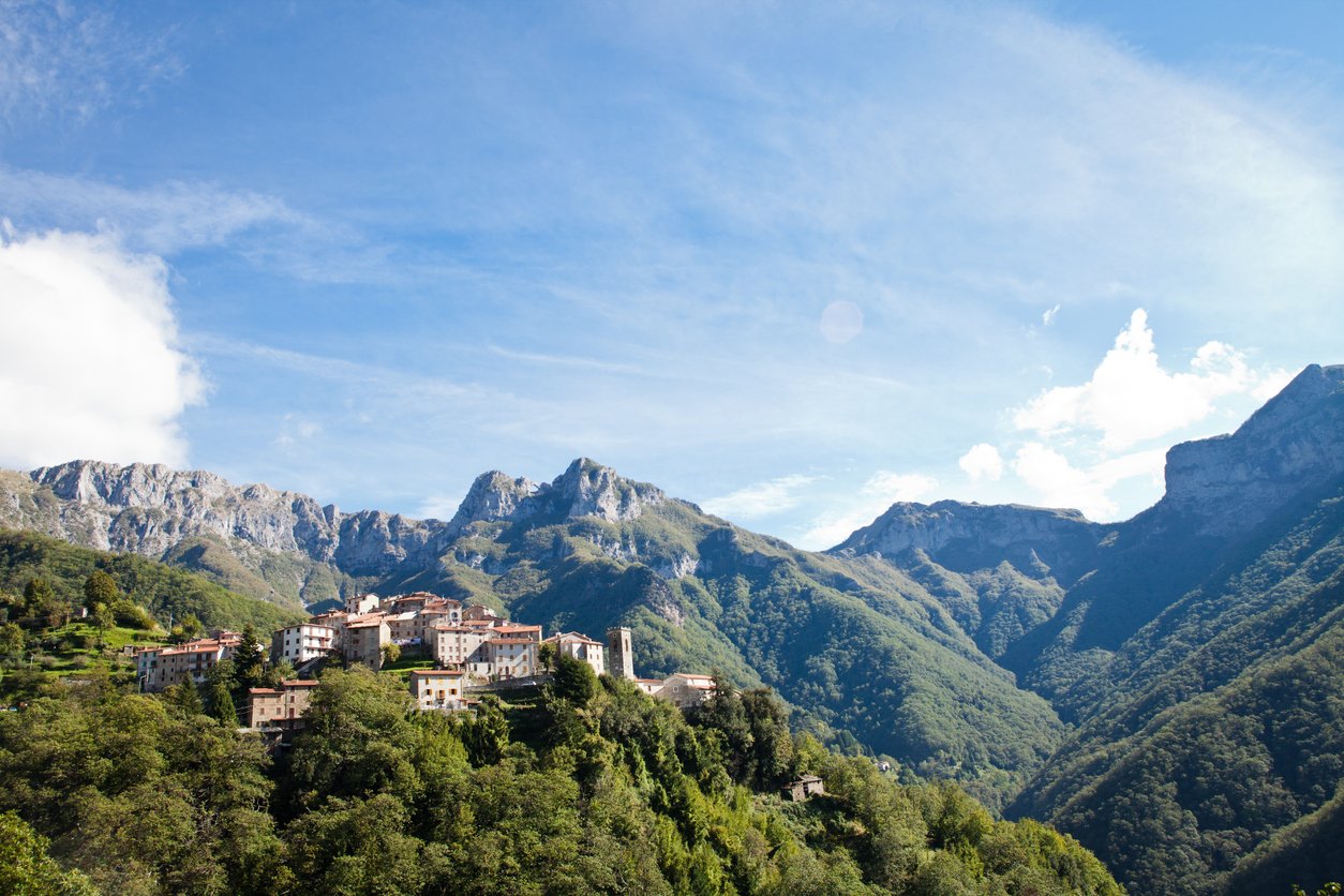 Monte Forato mountain in Tuscany, with a village perched beneath its summits.