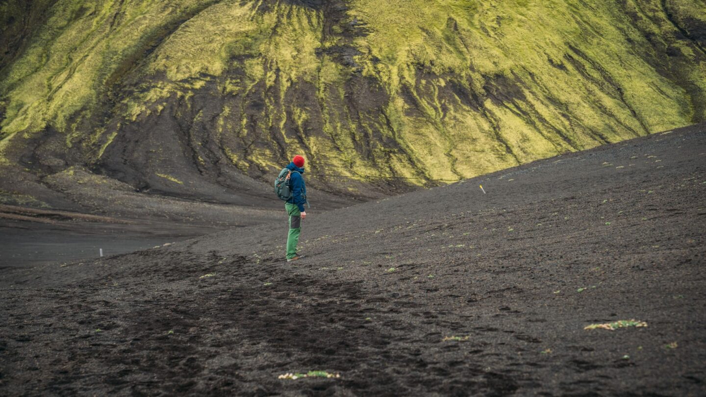 One hiker on the green slopes of Iceland