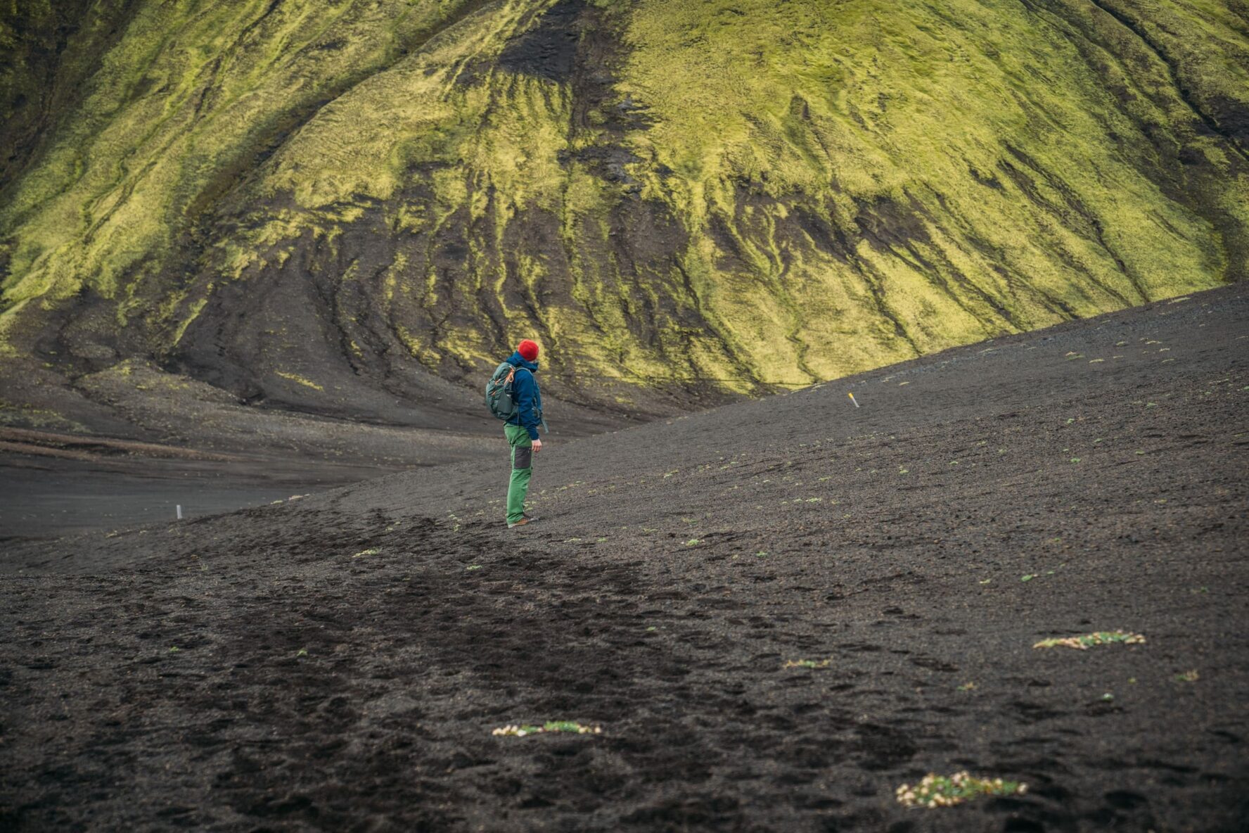 One hiker on the green slopes of Iceland
