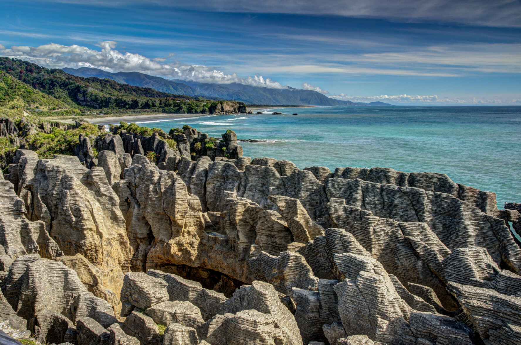 Famous rock formation by the coast of New Zealand - Pancake rocks and blowholes near Punakaiki.