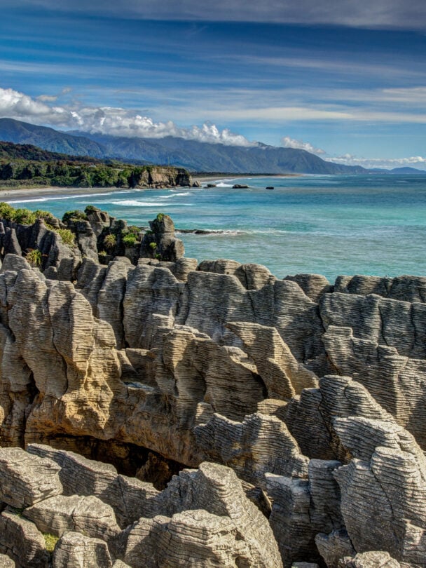 Cyclists on a path which is part of the iconic West Coast Wilderness Trail on the South Island in New Zealand