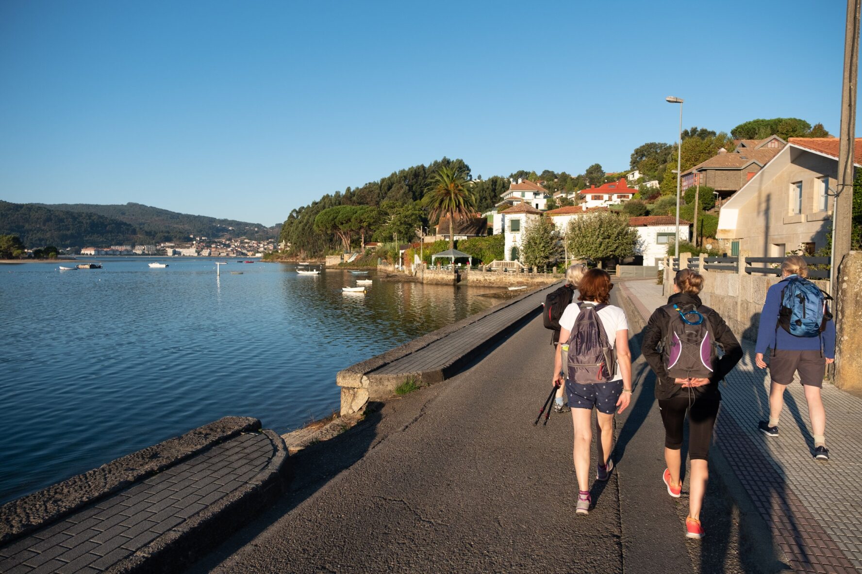 Women walking by the sea on Camino