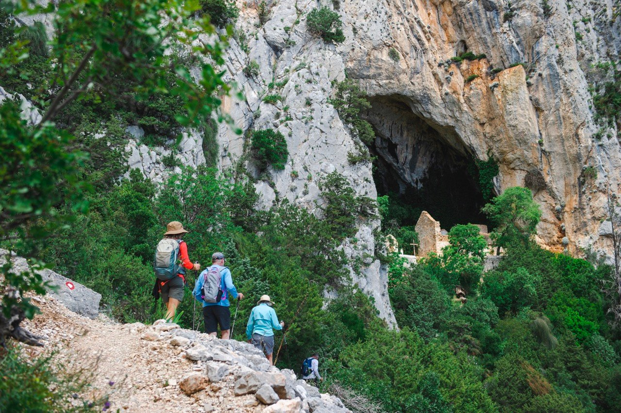 Hikers near a cave