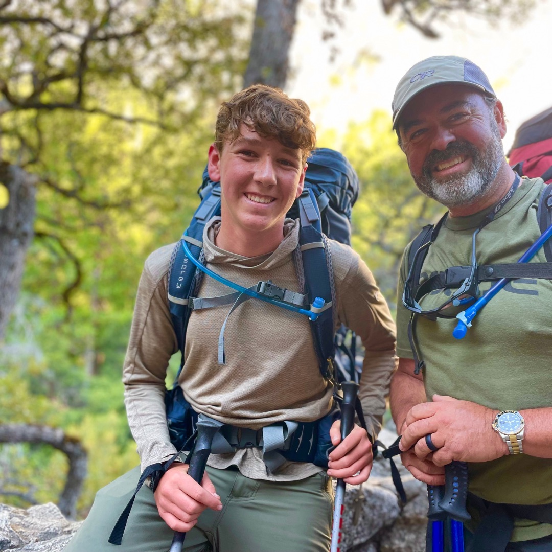 Father and son hiking the Half Dome