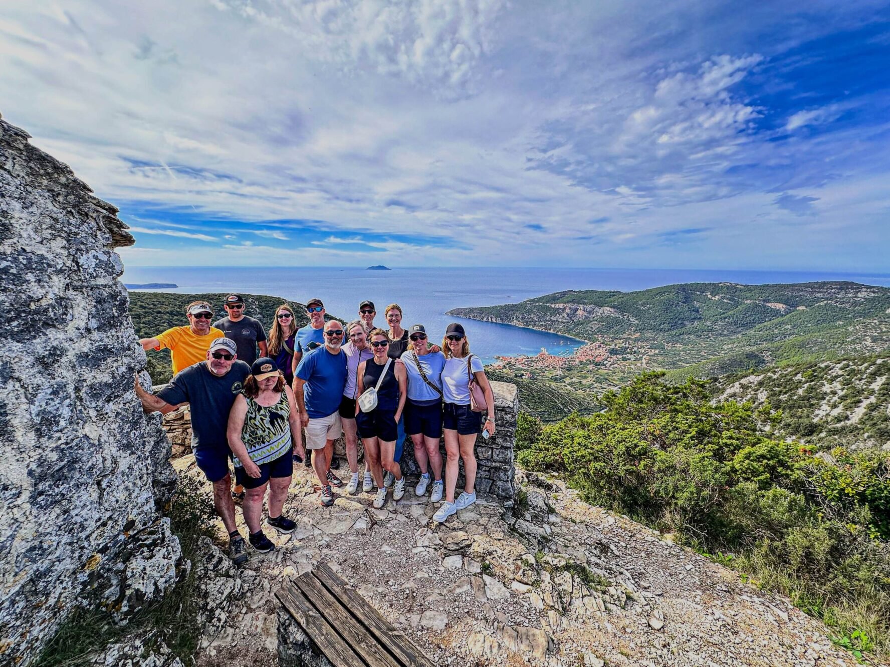 Hiking group smiling on a viewpoint on the island of Vis