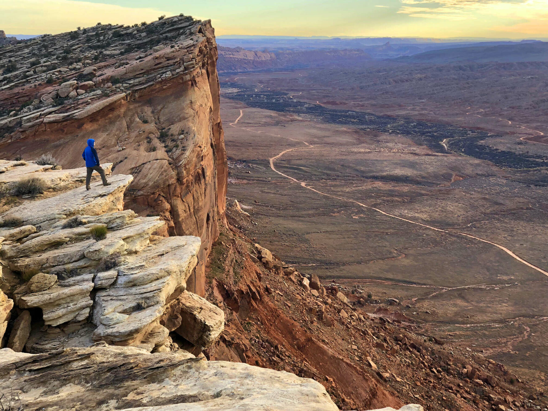 Hiker on a cliff in Utah