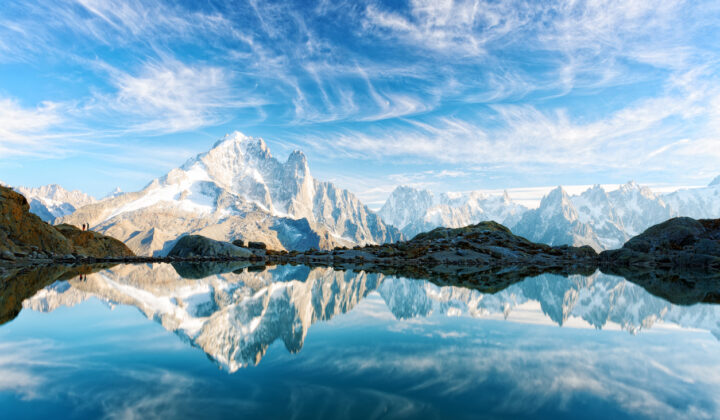 The glacial lake Lac Cheserys reflecting glaciated peaks seen during TMB trek.