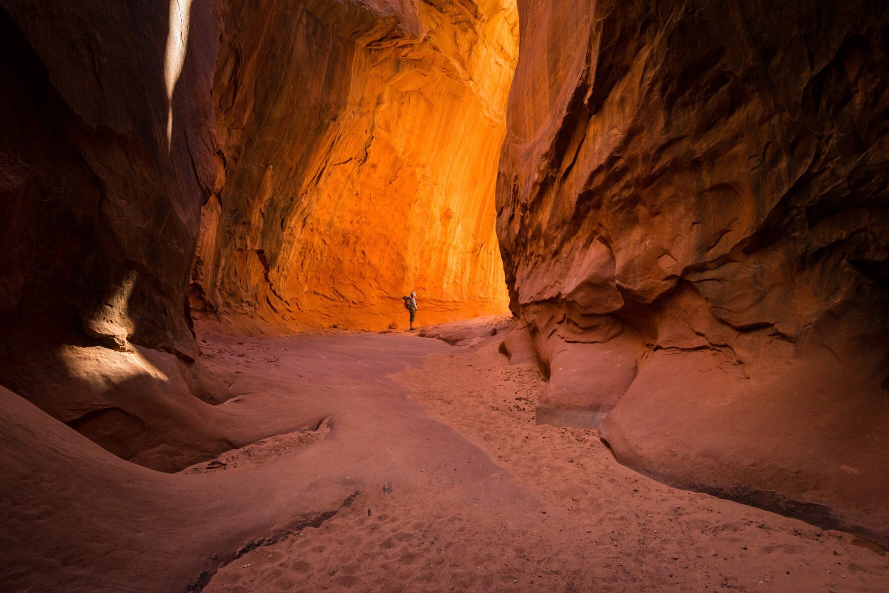 One hiker standing in a canyon