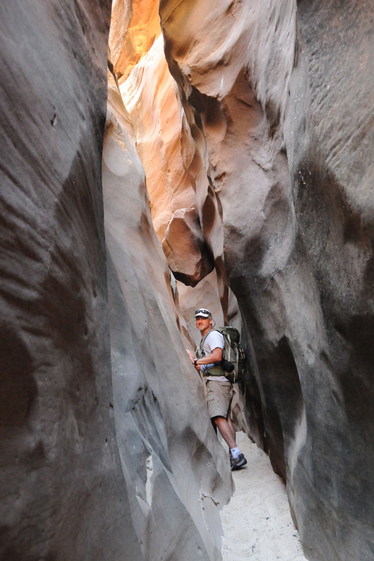 Slot canyon in Utah and hiker