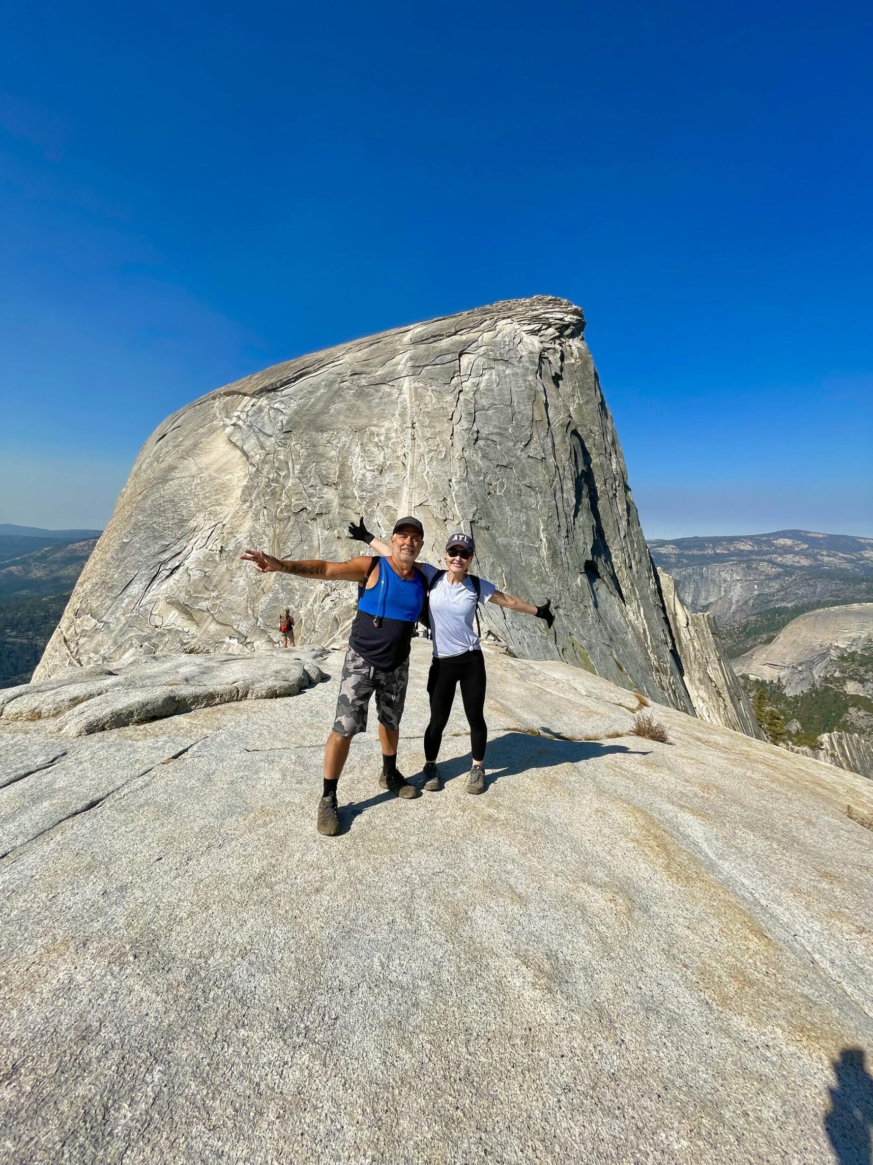 Two hikers in front of the Half Dome