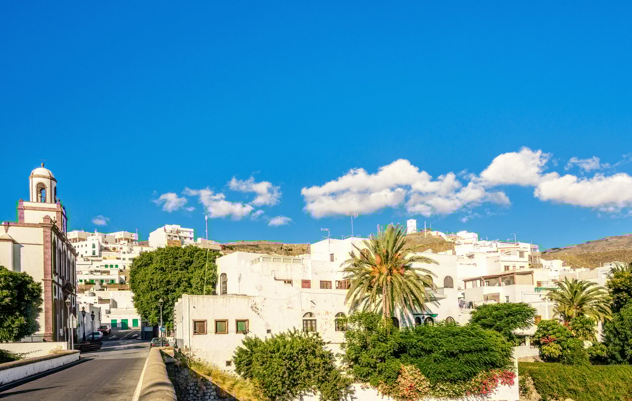 The coastal town in north Gran Canaria, Agaete, with white-washed houses and a baroque church.