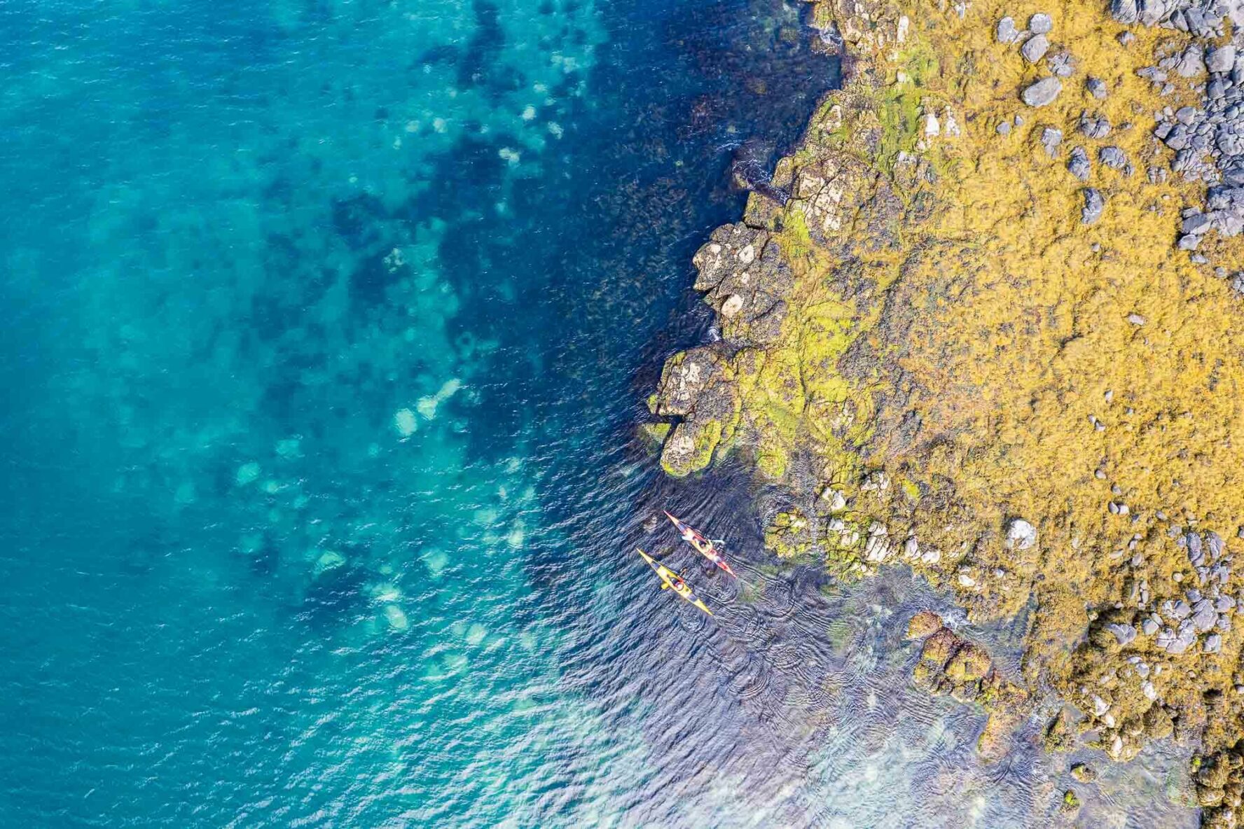 Blue waters in Iceland and kayaks