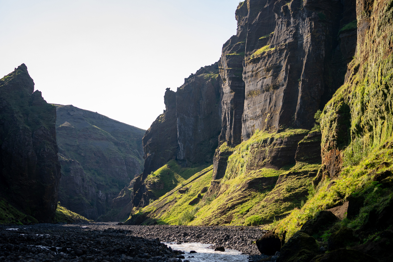 August of 2019. happy family hiking together in the Stakkholtsgja Canyon, Iceland. Walking along a scenic trail.